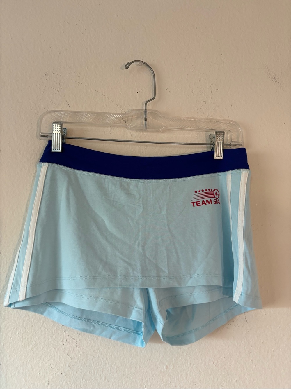 Team Gia blue skort with white side stripes